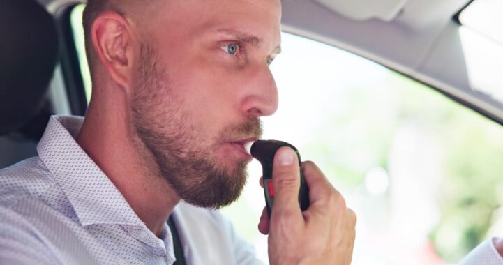 Man inside his car with an ignition interlock device - SR-22 Adviser, Cheap DUI Insurance