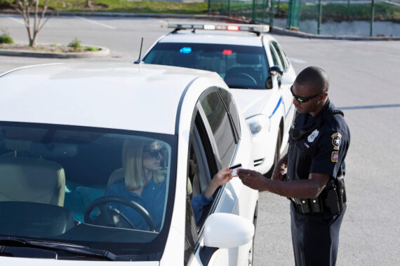 Police office pulling off a driver - cheap SR-22 insurance.